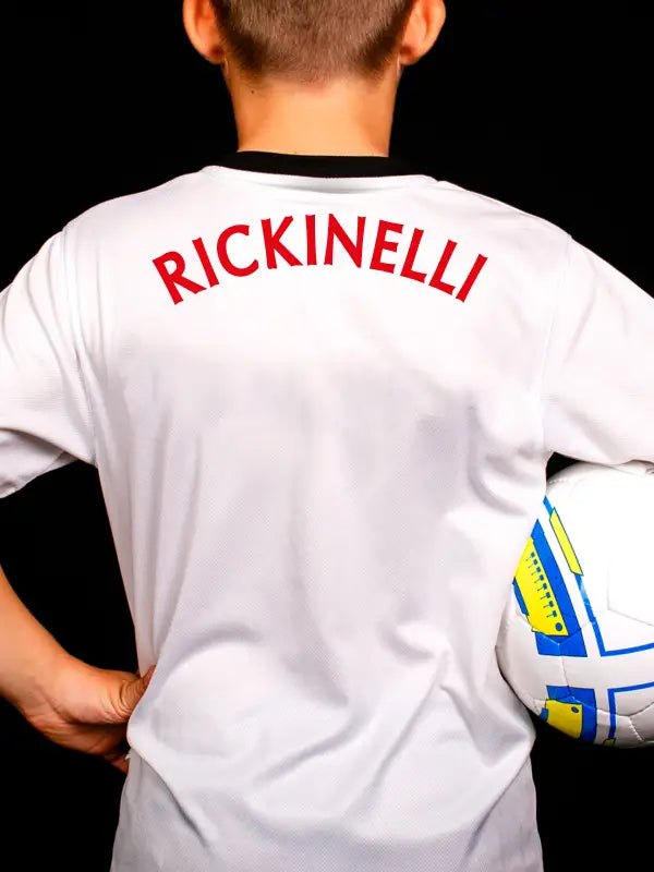 Football shirt with arched red name 'RICKINELLI' on back using football name and number iron on transfers.
