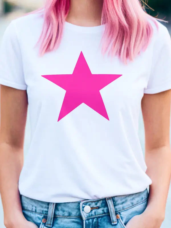 Woman in white t-shirt with a large pink iron on star transfer centred on the chest, showcasing the bold design.