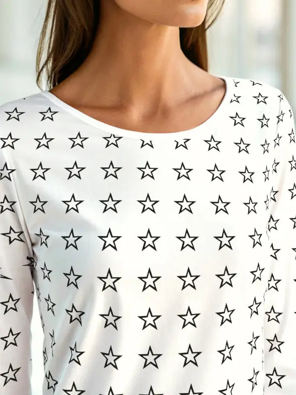 Long-sleeve shirt covered in small black outlined iron on stars, perfect for a bold custom garment look.