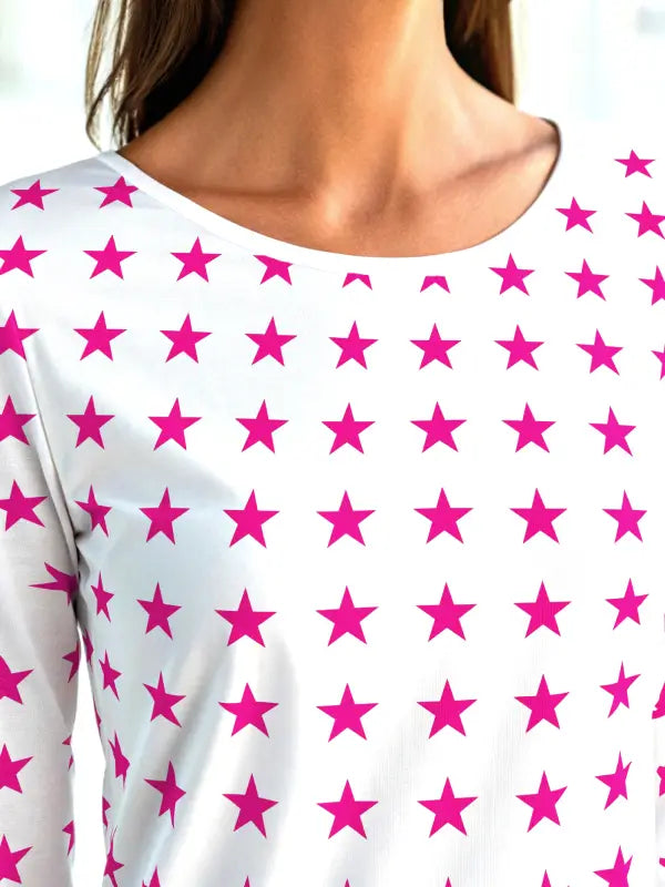 Long-sleeve shirt covered in small pink iron on stars, perfect for a bold custom garment look.
